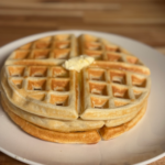 Fluffy homemade waffles from scratch with butter on top